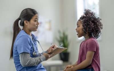A nurse interacting with a younger patient, highlighting the need for professional development in nursing and improving their patient connection skills